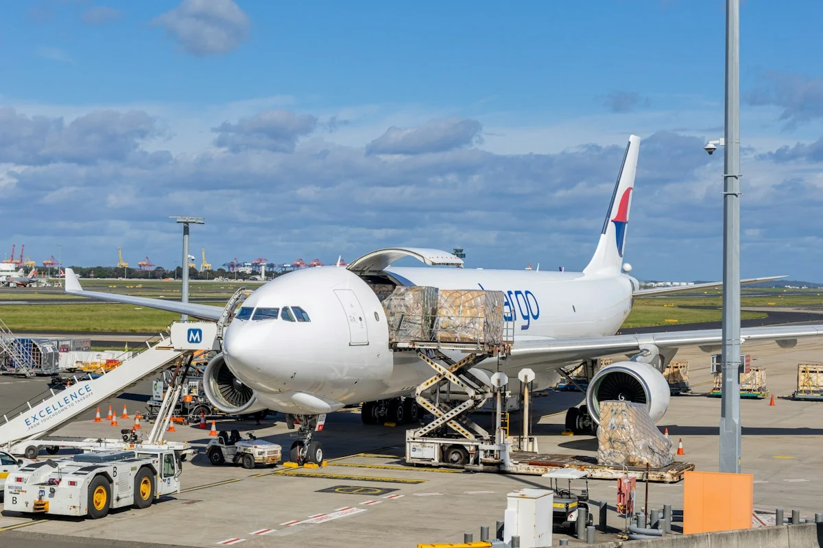 Cargo aircraft being loaded at an airport