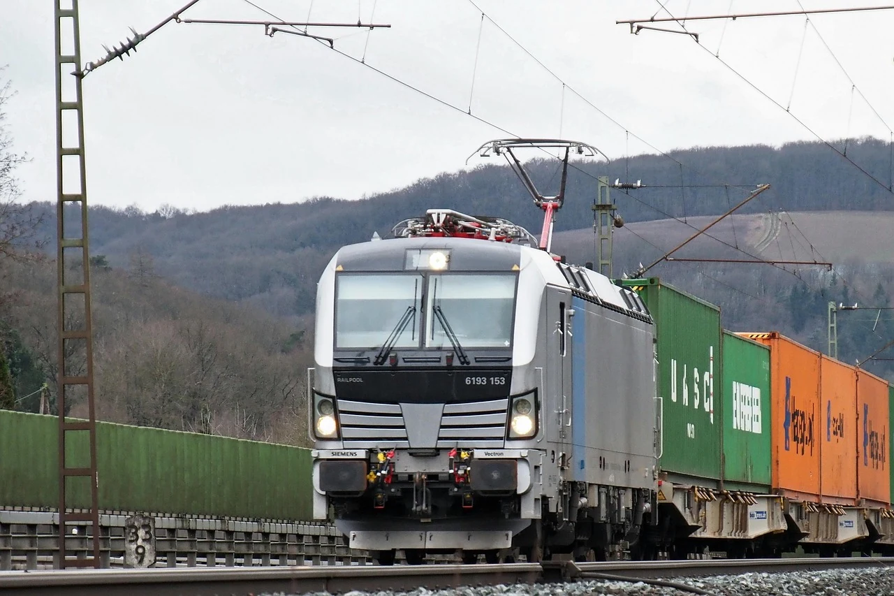 European electric freight locomotive pulling container wagons